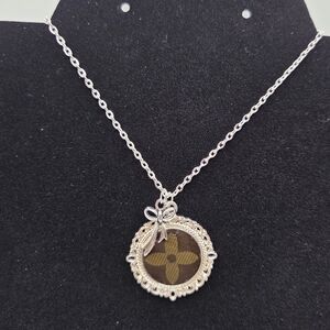 Upcycled Louis Vuitton Necklace In The Color Silver With Bow Charm